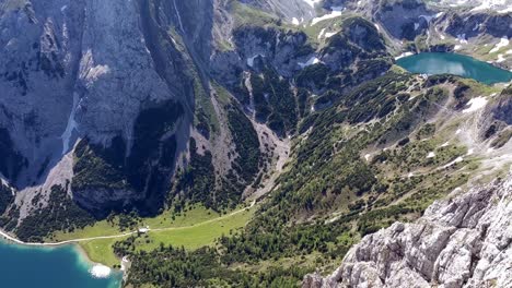 Aerial-camera-pan-of-Mieminger-mountains-in-Austria-Tyrol-with-Drachensee,-lodge-Coburger-Hütte-and-Seebensee