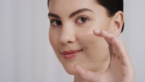 close-up-portrait-beautiful-young-caucasian-woman-holding-magnifying-glass-showing-smooth-healthy-skin-happy-female-smiling-enjoying-soft-perfect-complexion-skincare-concept