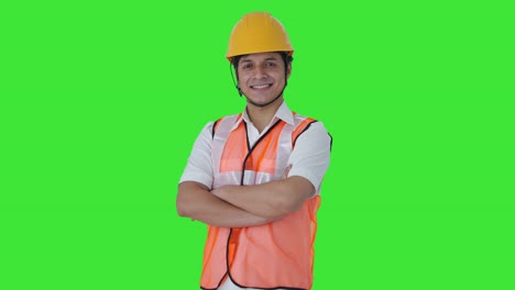 Portrait-of-Happy-Indian-architect-standing-crossed-hands-Green-screen