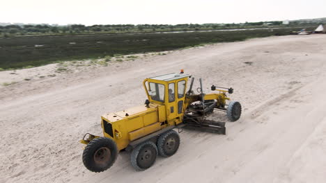 beach maintenance with excavator