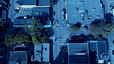 Davie-Village-aerial-drone-zoom-into-Jim-Deva-square-Bute-Street-people-crossing-historic-crosswalk-flag-rainbow1-2