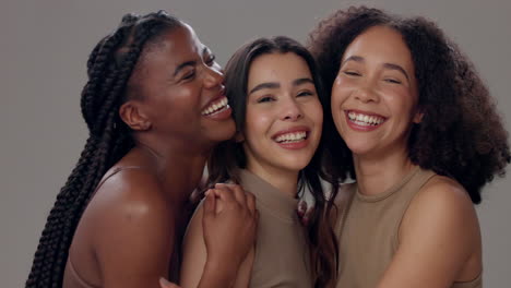 three friends smiling and embracing each other