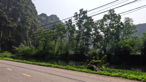 train passing through scenic mountain road in ninh binh