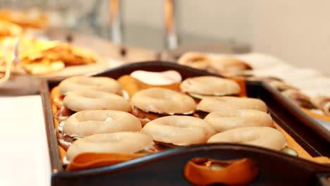 Fresh-bagels-being-made-and-getting-served