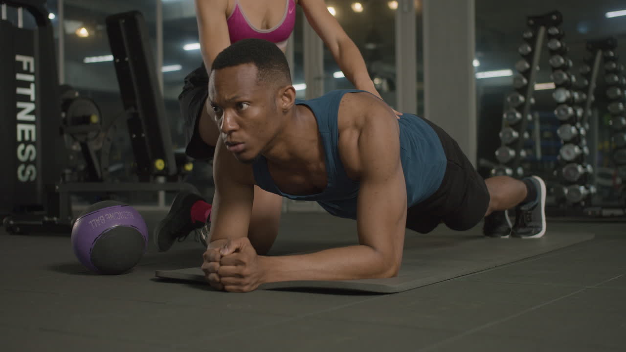 Close-up view of an athletic african american man in the gym.