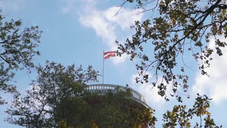 kemeri water tower with latvian flag in the kemeri resort park in jurmala, latvia