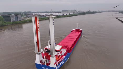 amasus cargo ship 'eems traveller' with rotor sails on a waterway