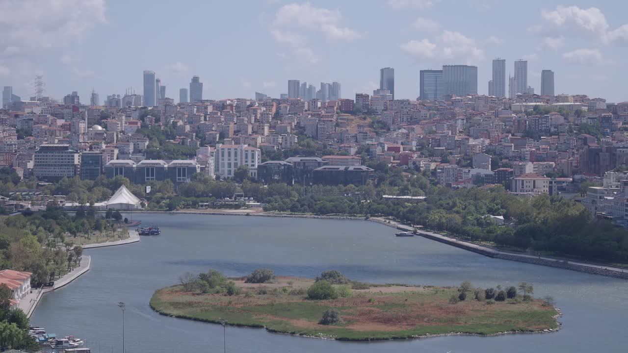 Cityscape with skyscrapers, lake, and island