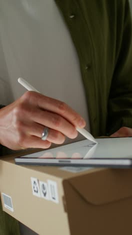 person signing for delivery or receiving a tablet