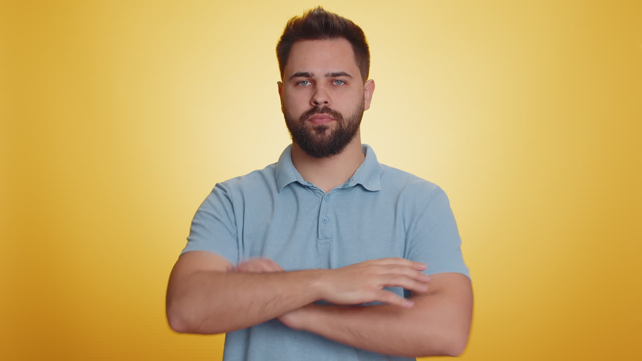 Caucasian young man shakes finger and saying no be careful avoid danger mistake disapproval sign