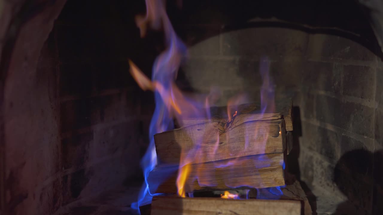 Lighting a fire in the fireplace. Infusion of liquid for ignition of coals. A stack of burning firewood