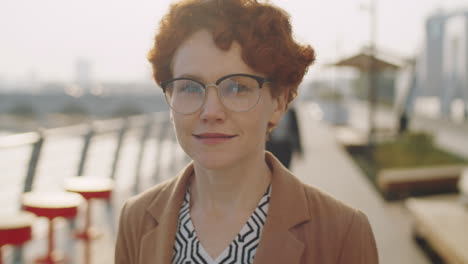 Portrait-of-Redhead-Businesswoman-on-Street