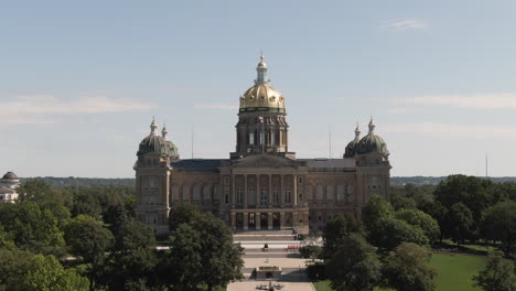 telephoto aerial tracking shot of iowa statehouse building on a clear summer day