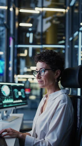 woman working late at night in a modern office