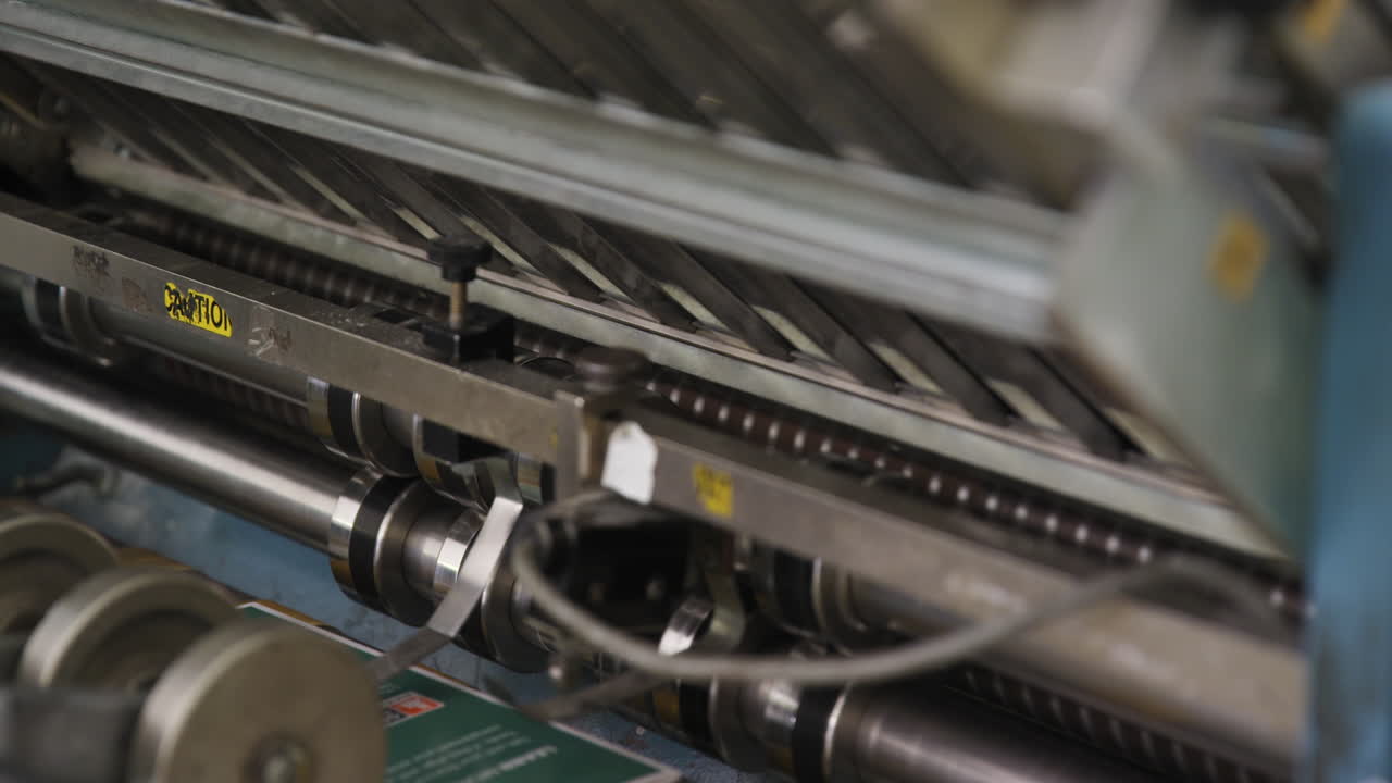 Custom Printed Pamphlets Coming Out Of An Offset Printing Machine