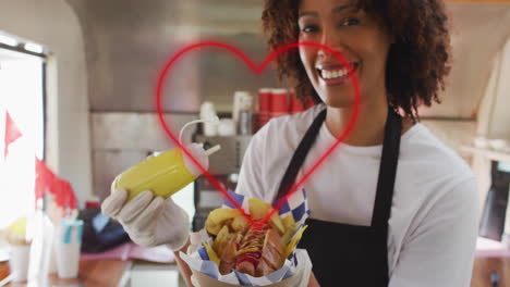 serving hot dog with mustard, heart animation over smiling vendor