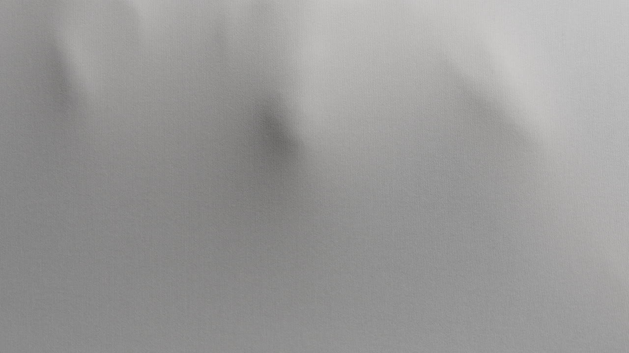 A creepy silhouette of a woman's body appears from the white surface