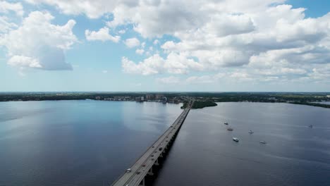 high altitude drone shot looking over the bridge from fort myers to cape coral