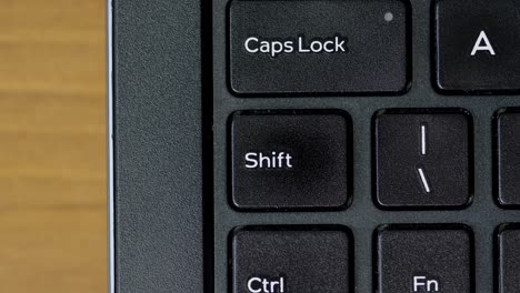 top view thumb pressing shift button keyboard