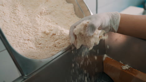 milling almonds into flour in food processor mill, grinding almond flour