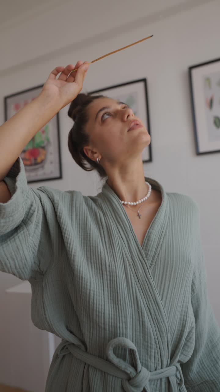 Woman indoors with incense