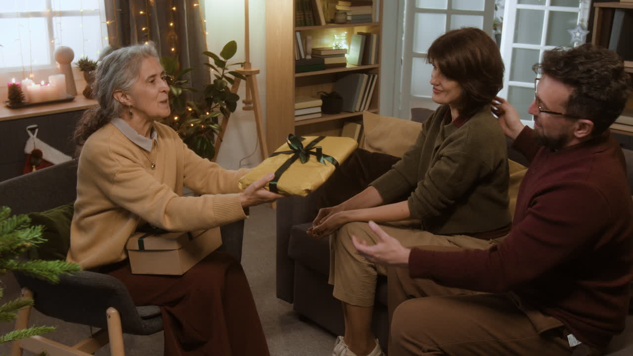 Family exchanging gifts during the holidays