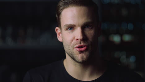 portrait of young handsome bearded man looking at camera.guy interviewing.