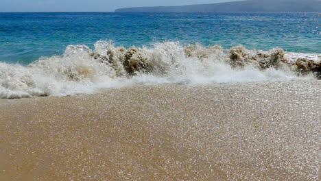 ocean waves on a sandy beach