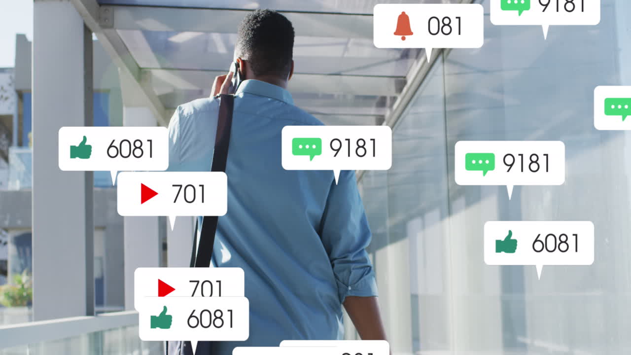 Animation of social media icons over african american businessman using smartphone in airport
