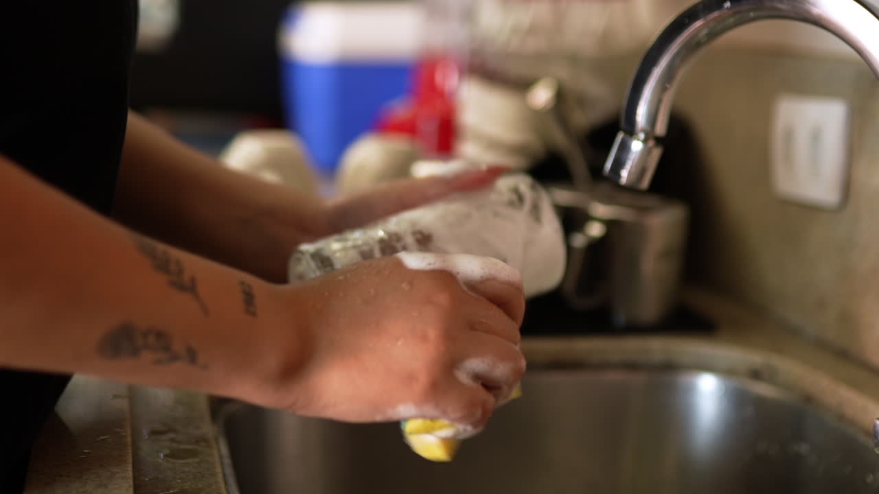 Woman washing long glass