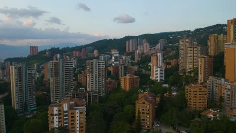 Condominium-Buildings-in-Colombian-City-Built-on-Andean-Hillsides-at-Sunset