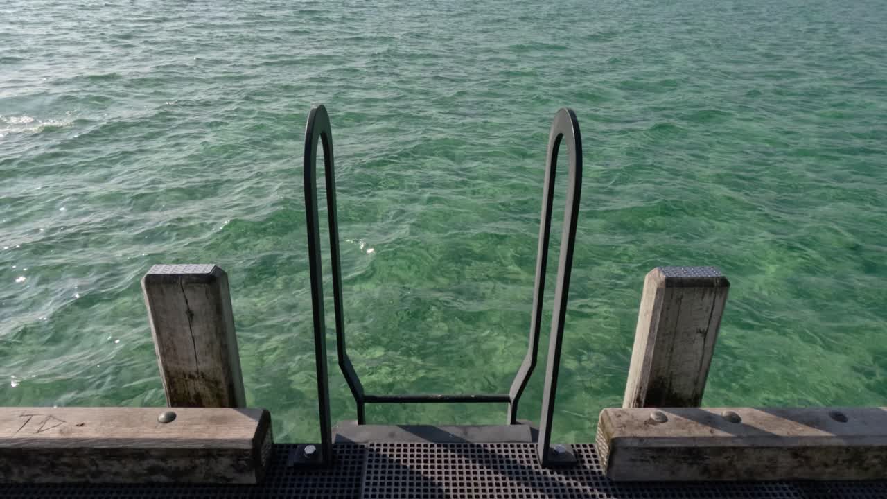 Ladder on pier with ocean view