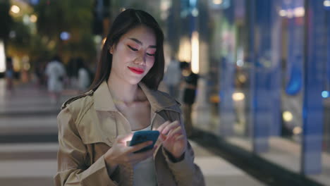 woman taking selfie at night in city street