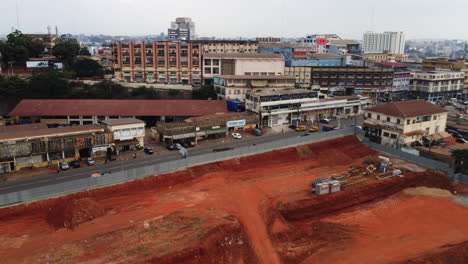Drone-shot-of-a-construction-project-site,-in-cloudy-Yaounde-city,-Cameroon