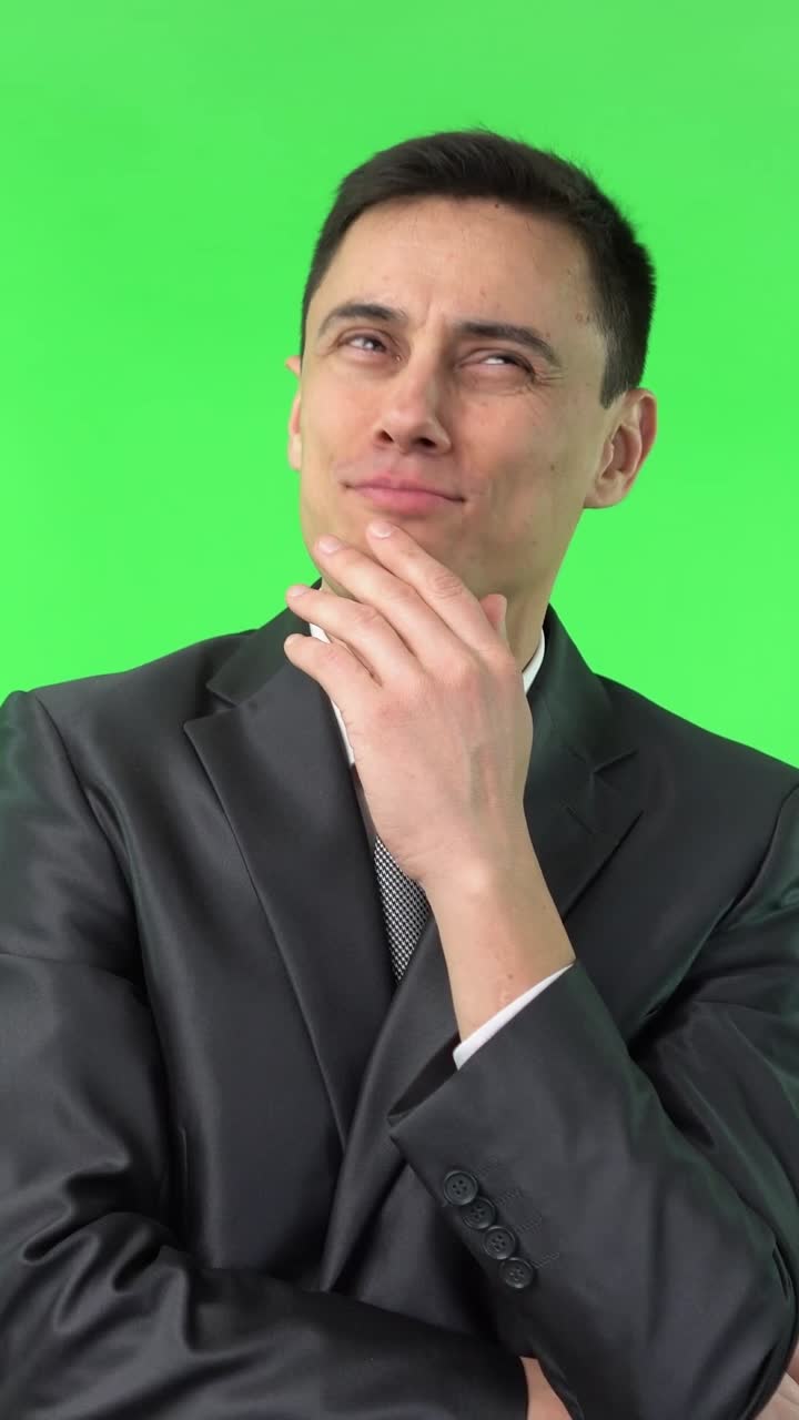 Man in Suit with Various Thinking and Contemplative Expressions on Green Screen
