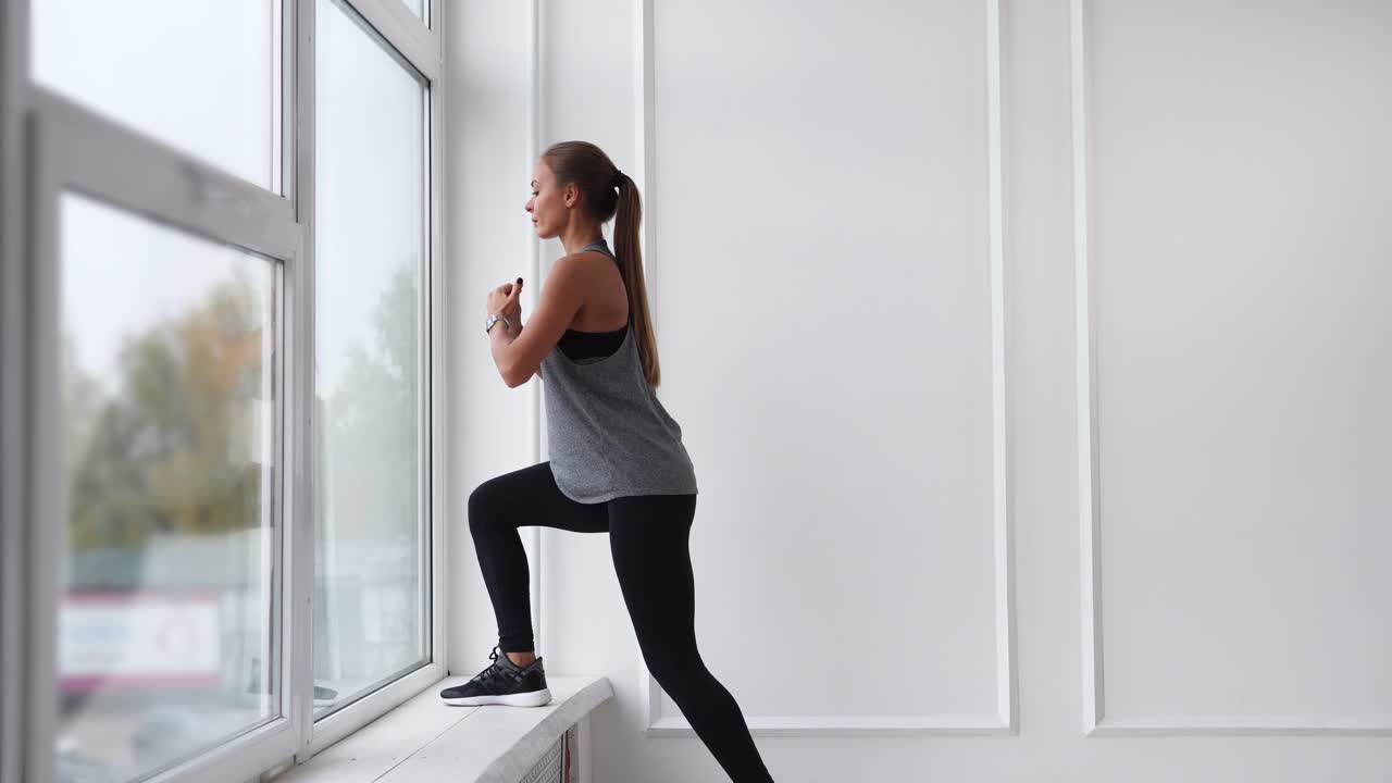 Woman doing a workout by the window
