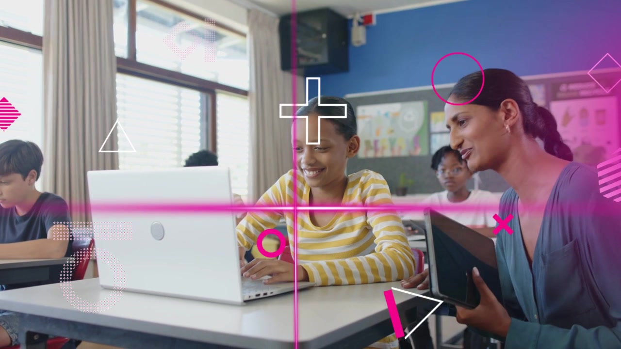 Child raising hand typing on laptop in class, teacher guiding with tablet, pink overlays appearing