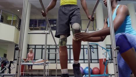 man exercising with prosthetic legs