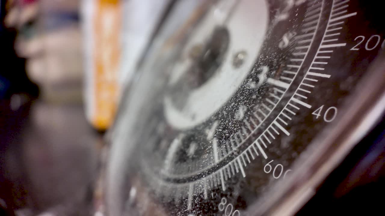Dirty old traditional kitchen weighing scales dial showing numbers and markings