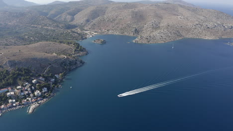 Motorboat-has-large-white-wake-wave-in-deep-blue-Aegean-Sea-in-Greece
