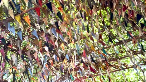 vibrant mobiles sway in the forest canopy