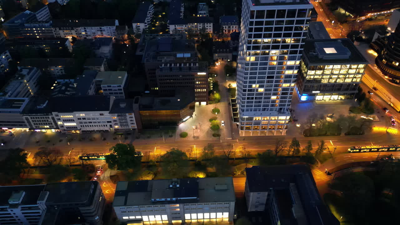 Aerial, drone view of Basel, Switzerland at night