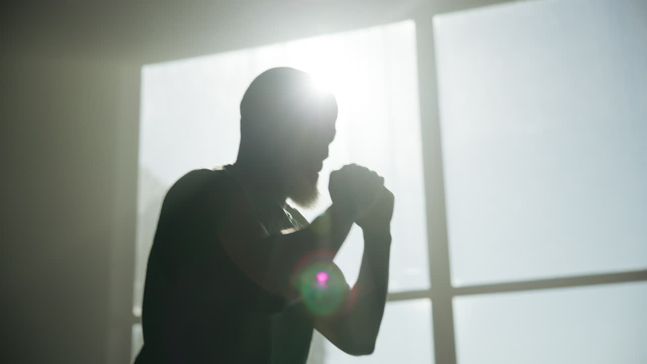 Man Boxing in Silhouette