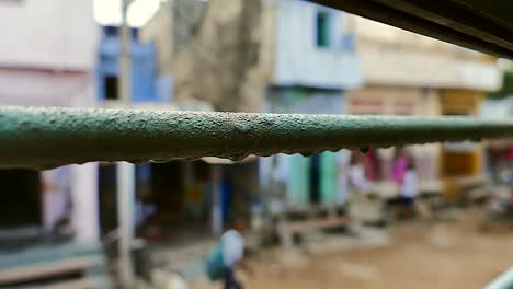 view through the moving indian train window grates in india in slow motion, indian railways