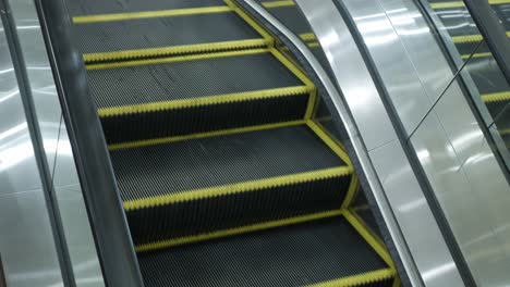 escalator in international airport without people while operating