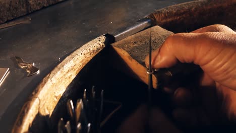 Goldsmith-working-in-workshop