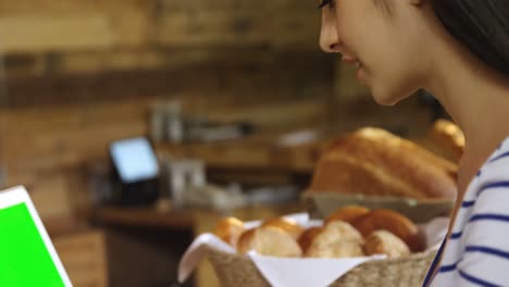 Woman-using-laptop-at-counter-4k