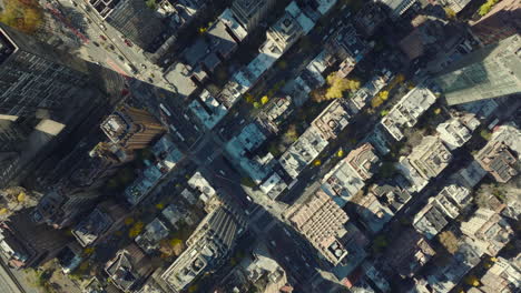 Aerial-birds-eye-overhead-top-down-view-of-apartment-buildings-and-busy-streets-between.-Manhattan,-New-York-City,-USA