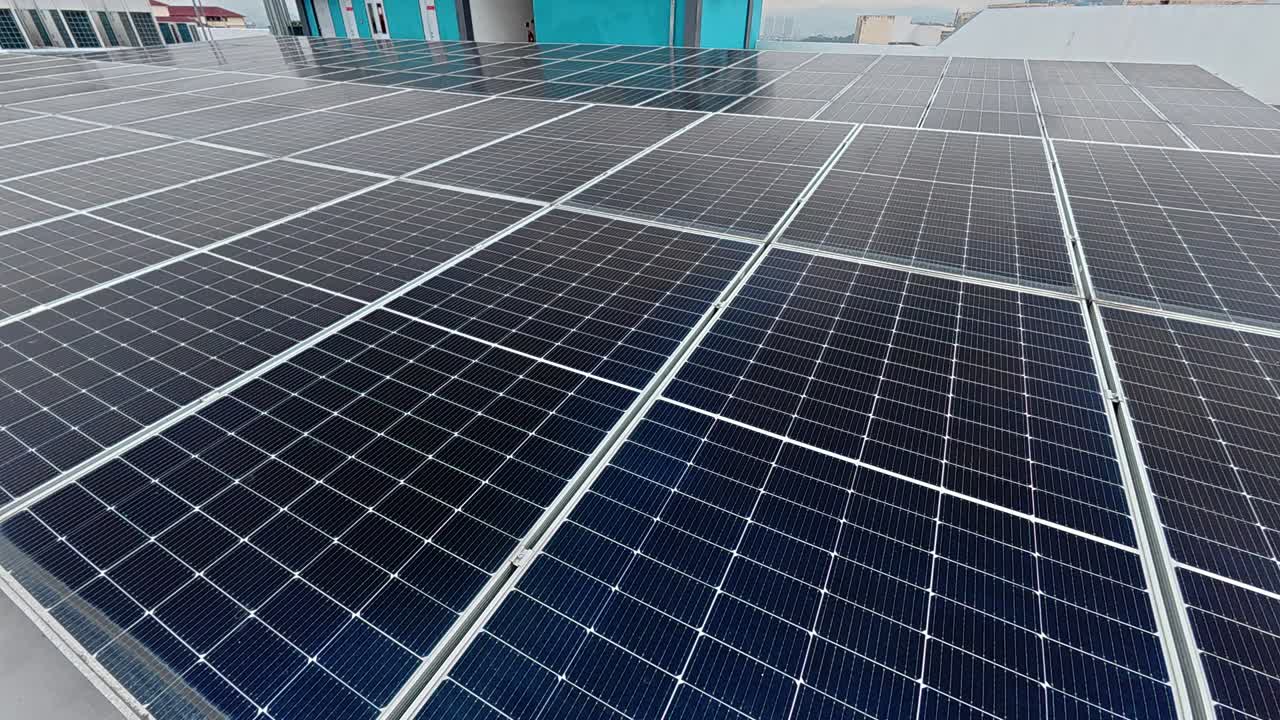 Rows of solar panels installed on a rooftop absorb sunlight, converting it into clean electricity. This sustainable energy source promotes environmental efficiency and supports green living.