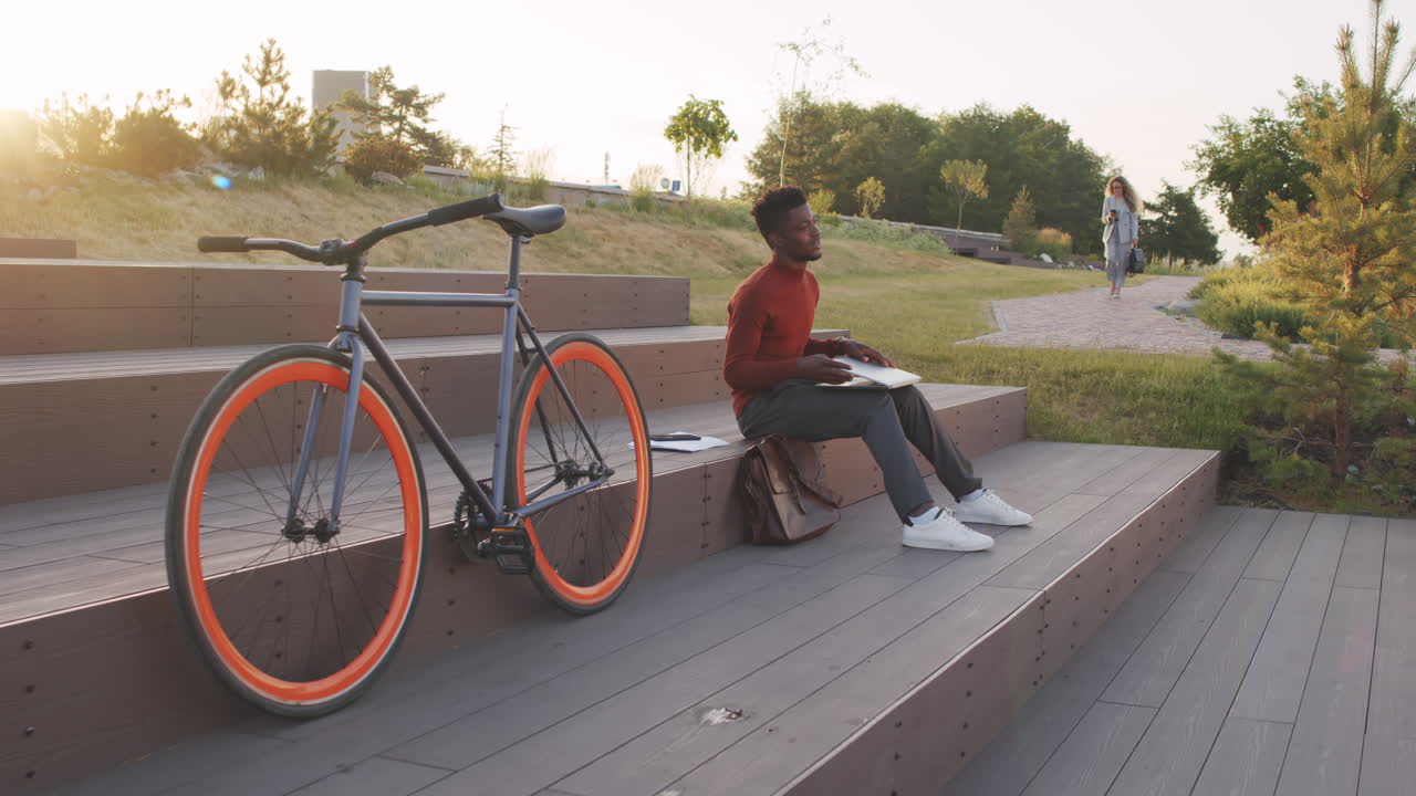 Young African-American Business Man Working on Laptop Outdoors